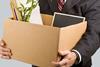 Man holding a box of office belongings
